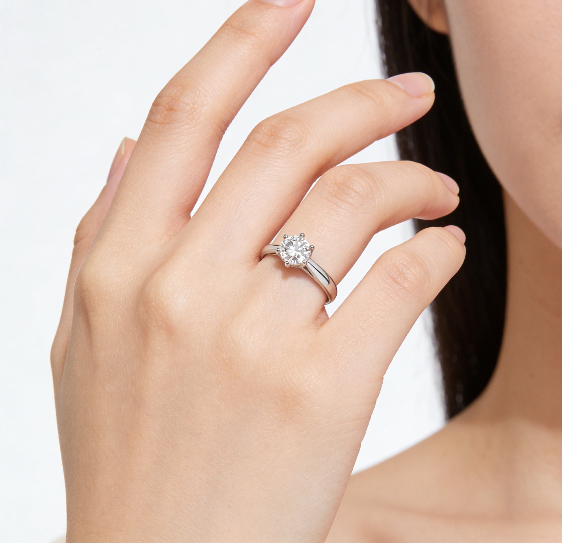 round diamond engagement ring on hand white gold solitaire everyday wear