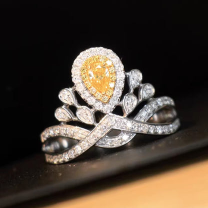 Yellow pear-shaped lab-grown diamond halo ring with floral crown design in 18K white gold, luxury statement ring with pavé band